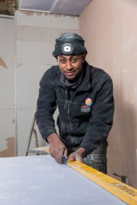 Ermias Soloman cutting plasterboard